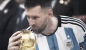messi-kissing-golden-ball-usagif-2081230708.gif