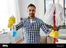 indian-man-with-mop-and-detergent-cleaning-at-home-WW6T29.webp