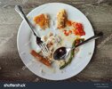 stock-photo-unfinished-meal-food-leftover-on-a-plate-that-is-causing-food-waste-and-bad-for-en...jpg