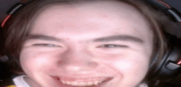 a close up of a person 's face wearing headphones and smiling