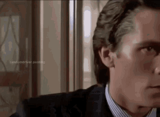 a close up of a man 's face with the words randomdriver.posting visible