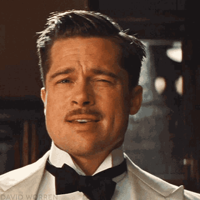 a close up of a man 's face with the name david worren visible