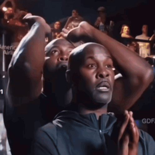 a man stands in front of a sign that says american airlines on it