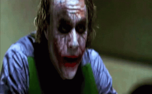 a close up of the joker 's face with blood on his face a close up of the joker 's face with blood on his face