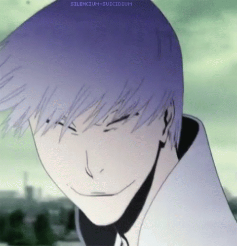 a close up of a person 's face with a purple haircut and a smile .