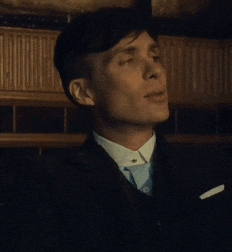 a close up of a man 's face with his mouth open