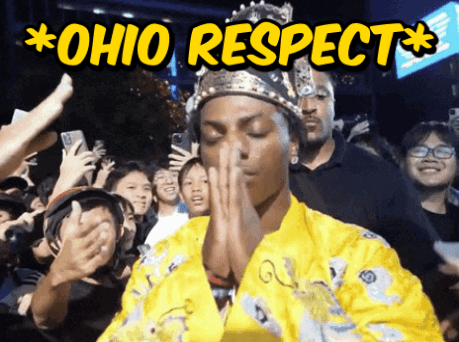 a man wearing a crown stands in front of a crowd that says  ohio respect 