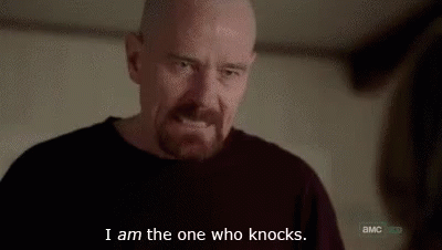 a man with a beard is making a funny face and says `` i am the one who knocks . ''