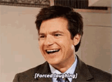 jason-bateman-forced-laughing.gif