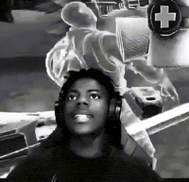 a black and white photo of a man wearing headphones with a cross in the background