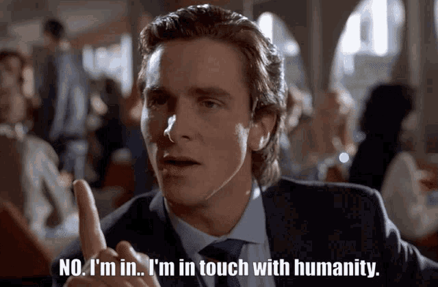 a man in a suit and tie is saying no i 'm in i 'm in touch with humanity