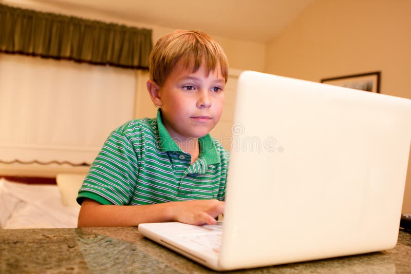 Boy typing on white laptop stock image. Image of keyboard - 22809011