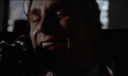 a close up of a man 's face with water coming out of his nose